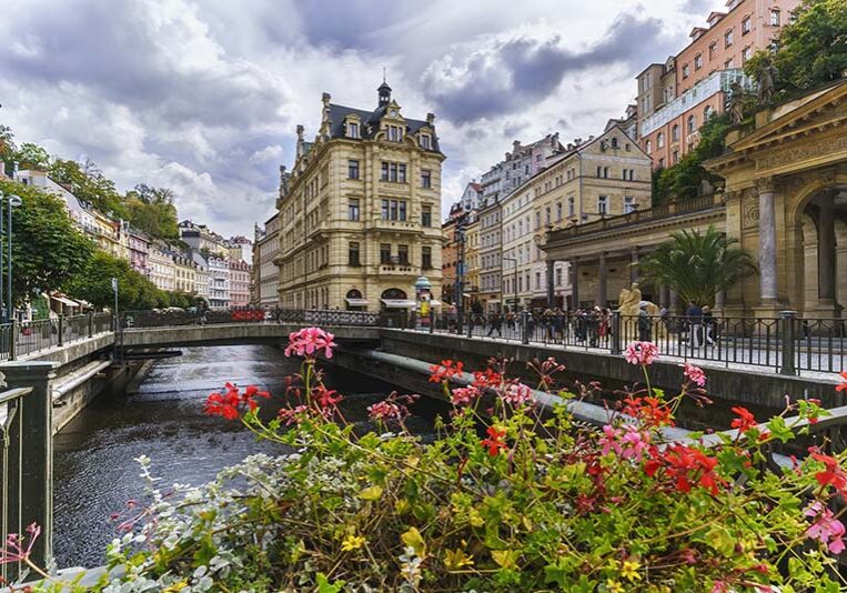 Karlovy Vary , Czech Republic - September 9 , 2018 : Tourists visiting beautiful historic Karlovy Vary or Carlsbad which is the most visited spa town in western Bohemia, Czech Republic